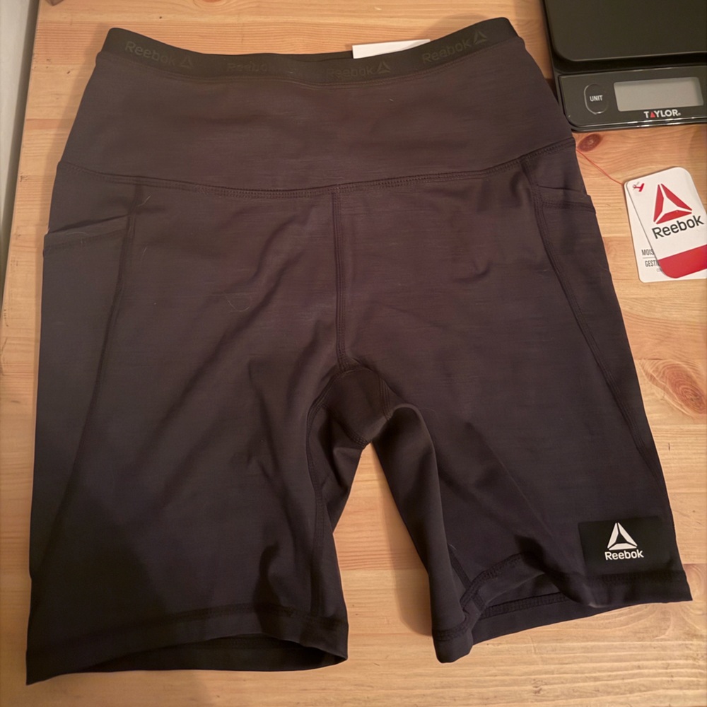 Black Reebok biker shorts with pockets